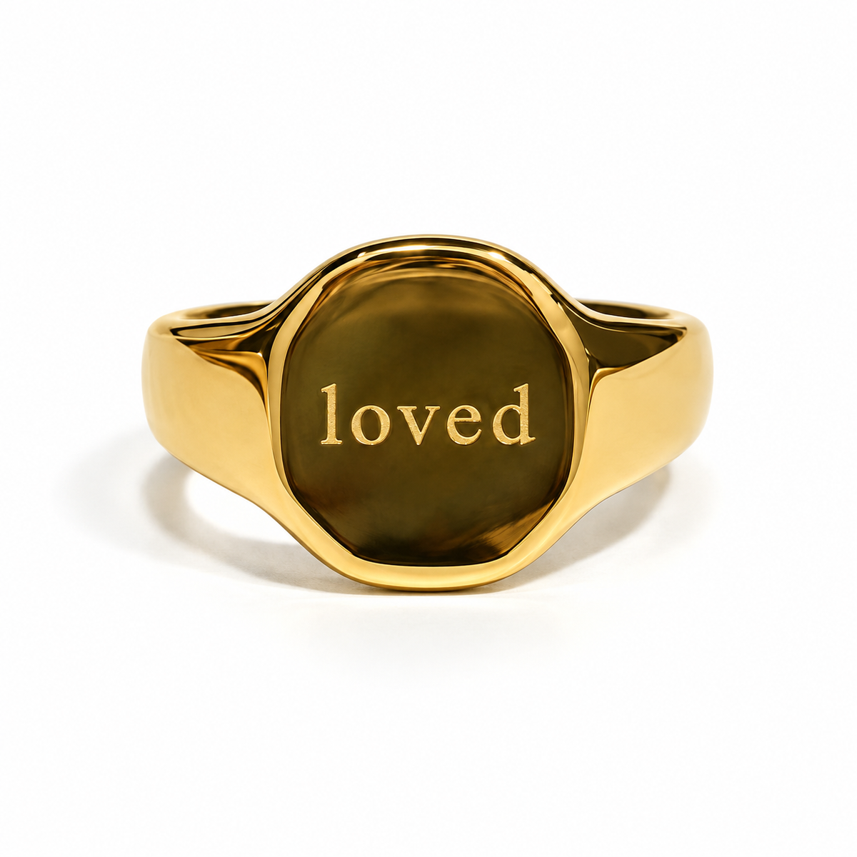 Gold Loved signet ring on white background